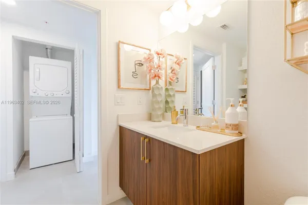 a bathroom with a sink vanity and a mirror