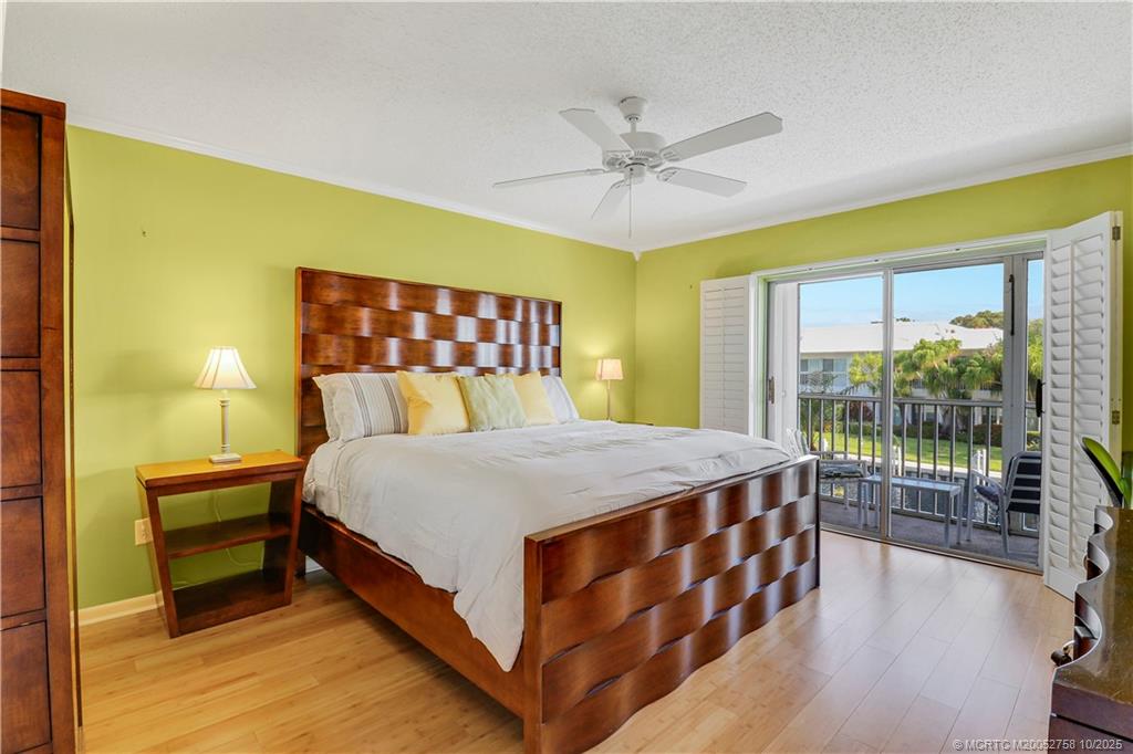 1866 Southwest Palm City Road, Unit 204 Stuart, FL 34994 - Photo 18 of 56 a bed sitting in a spacious bedroom next to a window