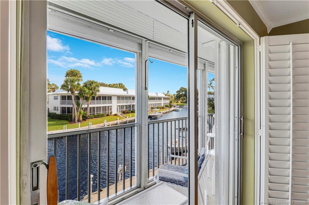 1866 Southwest Palm City Road, Unit 204 Stuart, FL 34994 - Photo 20 of 56 a view of a balcony with a floor to ceiling window