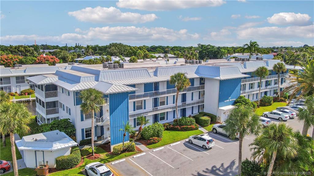1866 Southwest Palm City Road, Unit 204 Stuart, FL 34994 - Photo 2 of 56 a view of a city and tall buildings