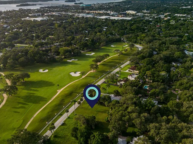 view of a golf course with parking space