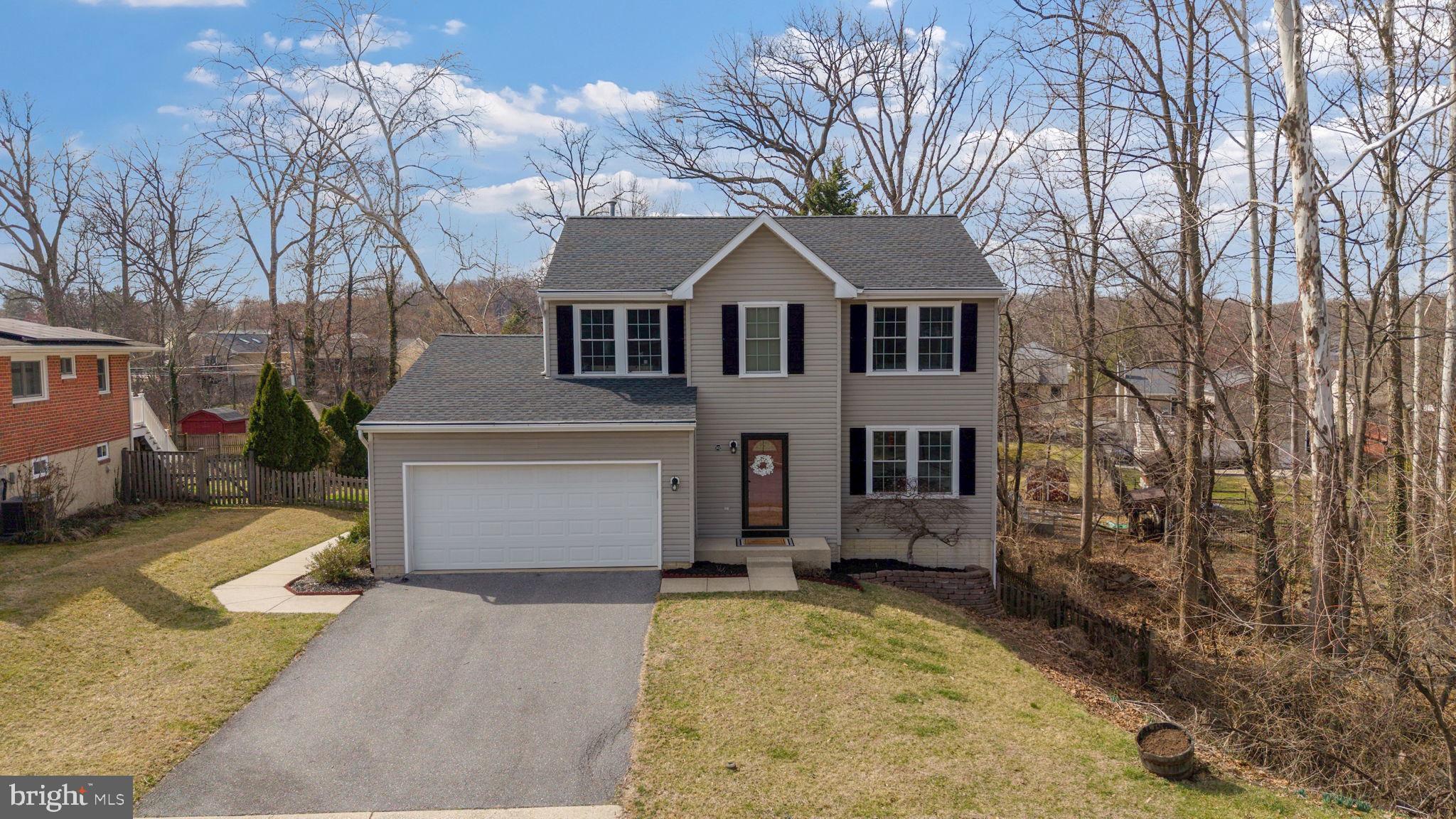 502 Durango Road Catonsville, MD 21228 - Photo 1 of 74 a front view of a house with a yard and garage