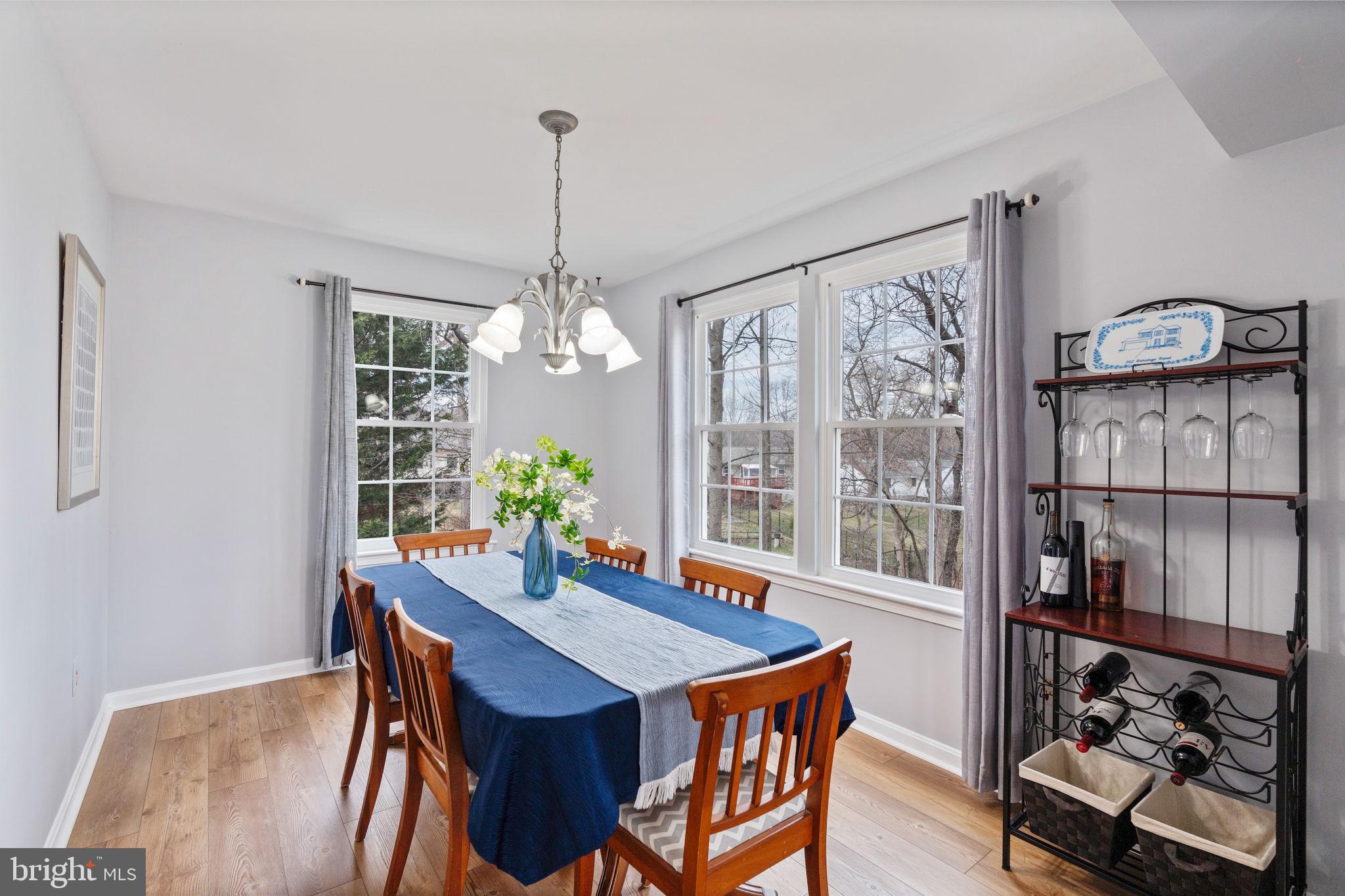 502 Durango Road Catonsville, MD 21228 - Photo 13 of 74 a view of a dining room with furniture window and wooden floor
