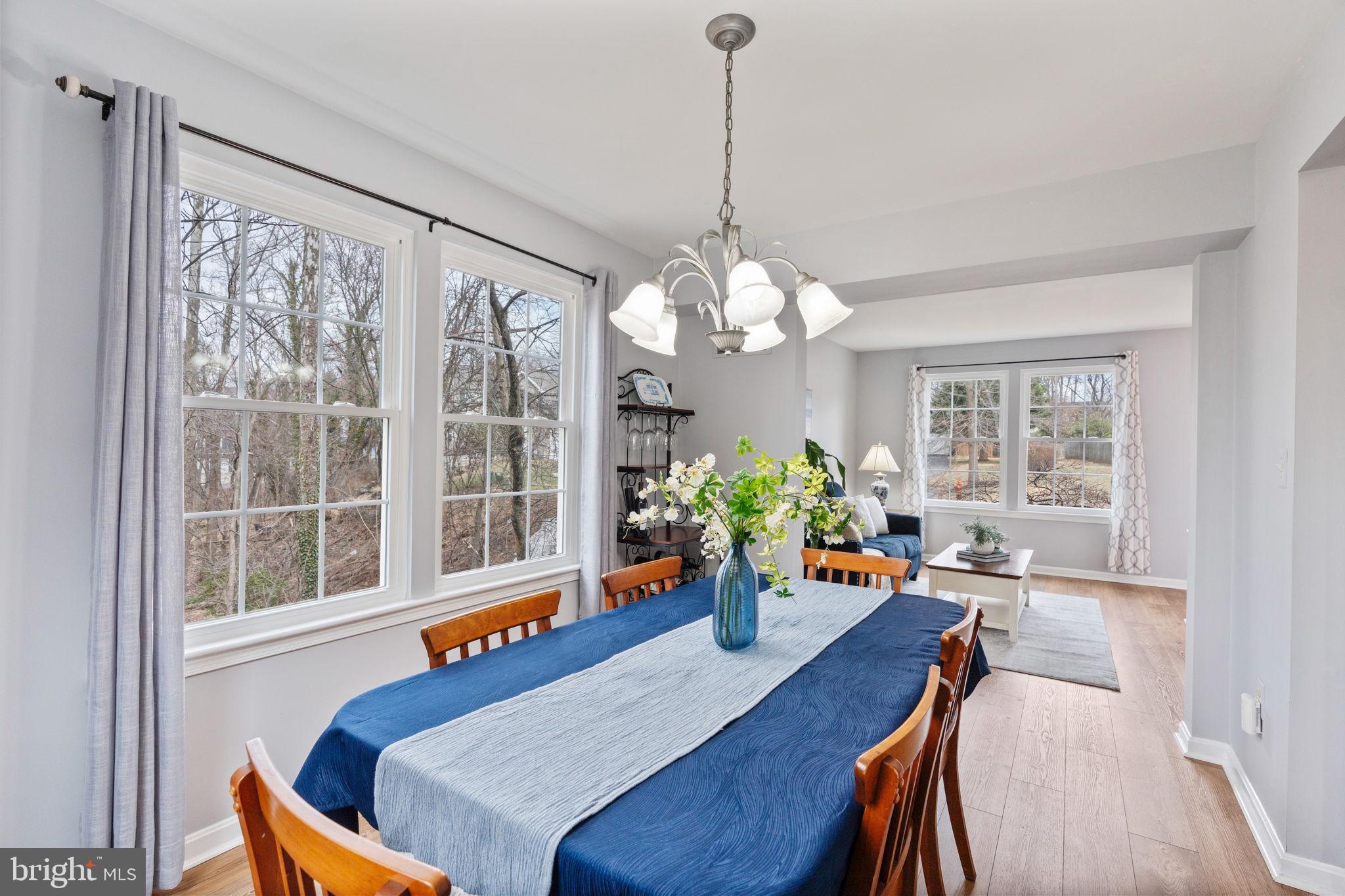 502 Durango Road Catonsville, MD 21228 - Photo 14 of 74 a view of a dining room with furniture a chandelier and wooden floor