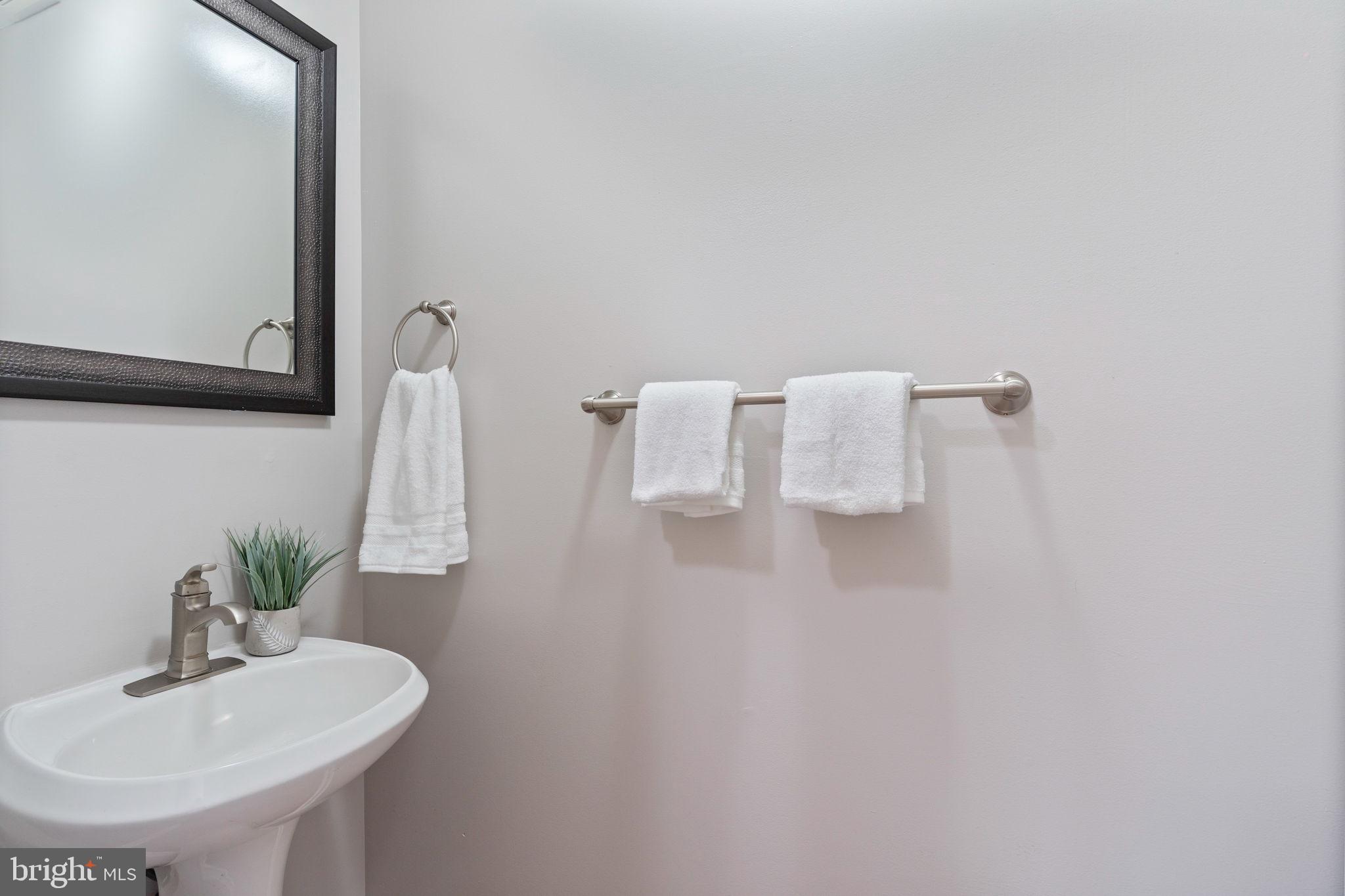 502 Durango Road Catonsville, MD 21228 - Photo 16 of 74 a bathroom with a sink and a mirror