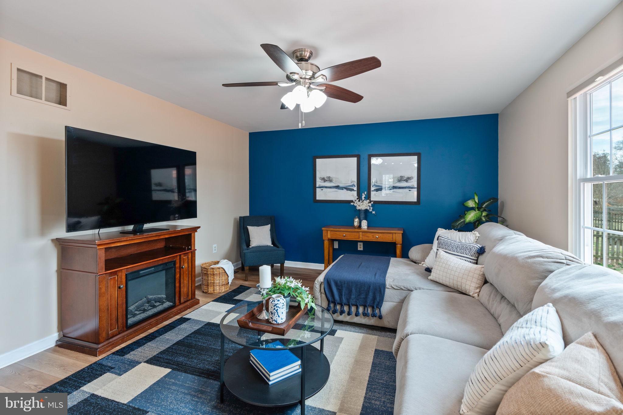 502 Durango Road Catonsville, MD 21228 - Photo 20 of 74 a living room with furniture a flat screen tv and a window