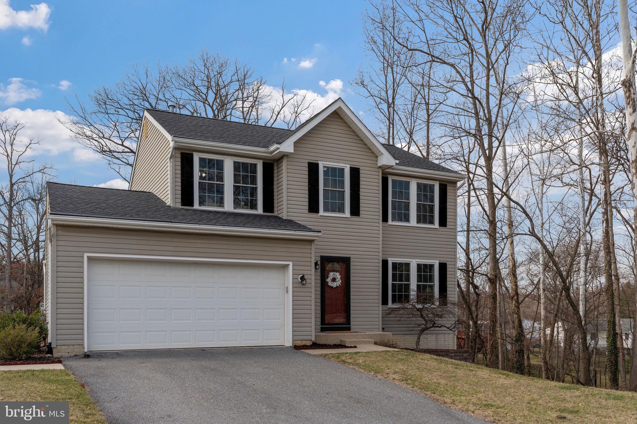 502 Durango Road Catonsville, MD 21228 - Photo 2 of 74 a front view of a house with a garage