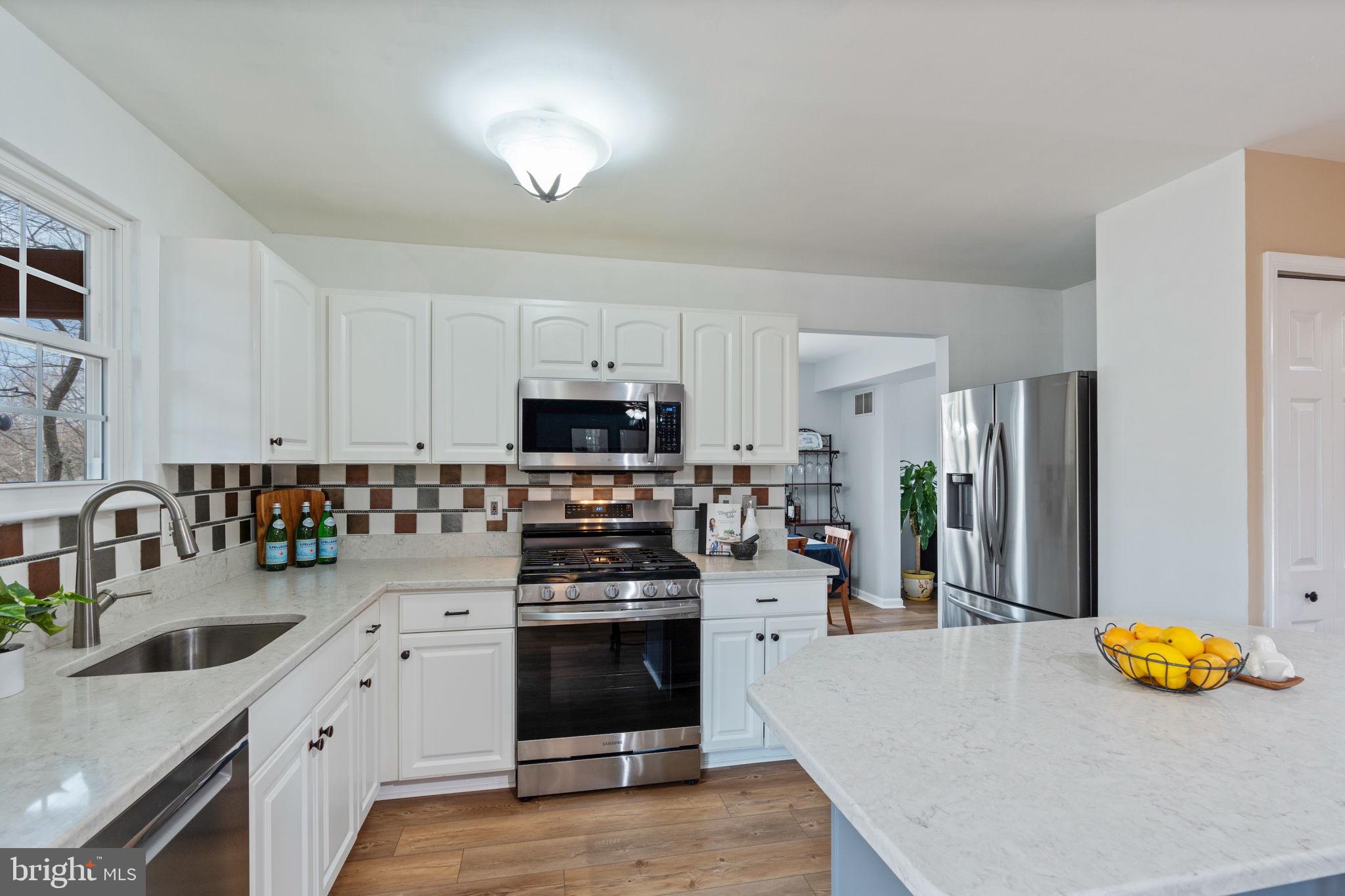 502 Durango Road Catonsville, MD 21228 - Photo 26 of 74 a kitchen with stainless steel appliances a stove a sink and a refrigerator