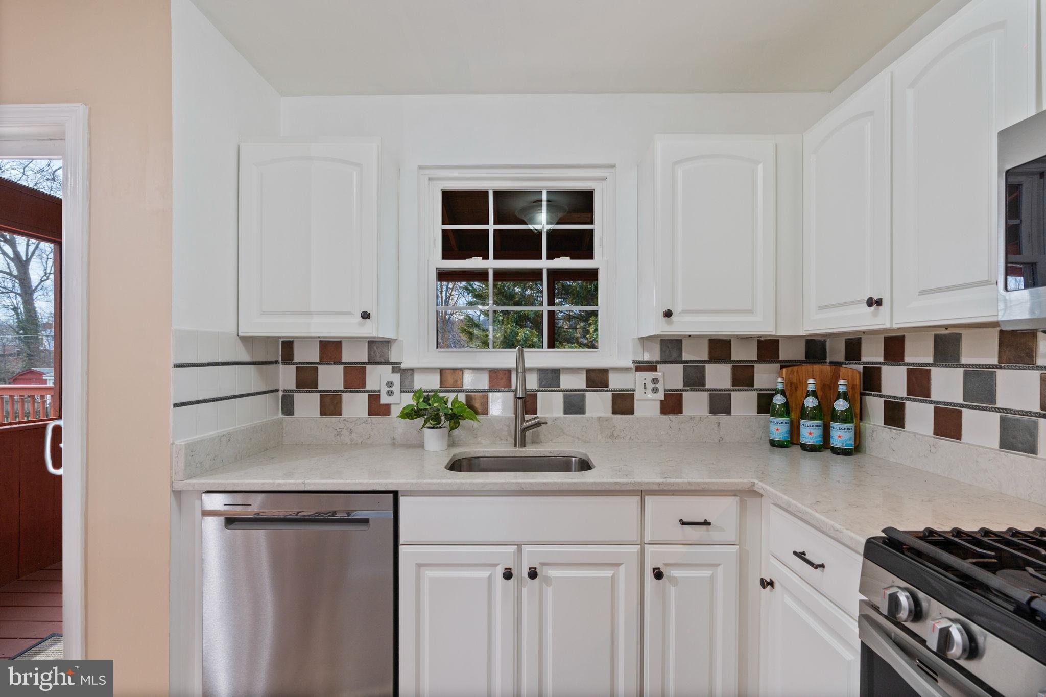 502 Durango Road Catonsville, MD 21228 - Photo 27 of 74 a kitchen with a sink cabinets and window