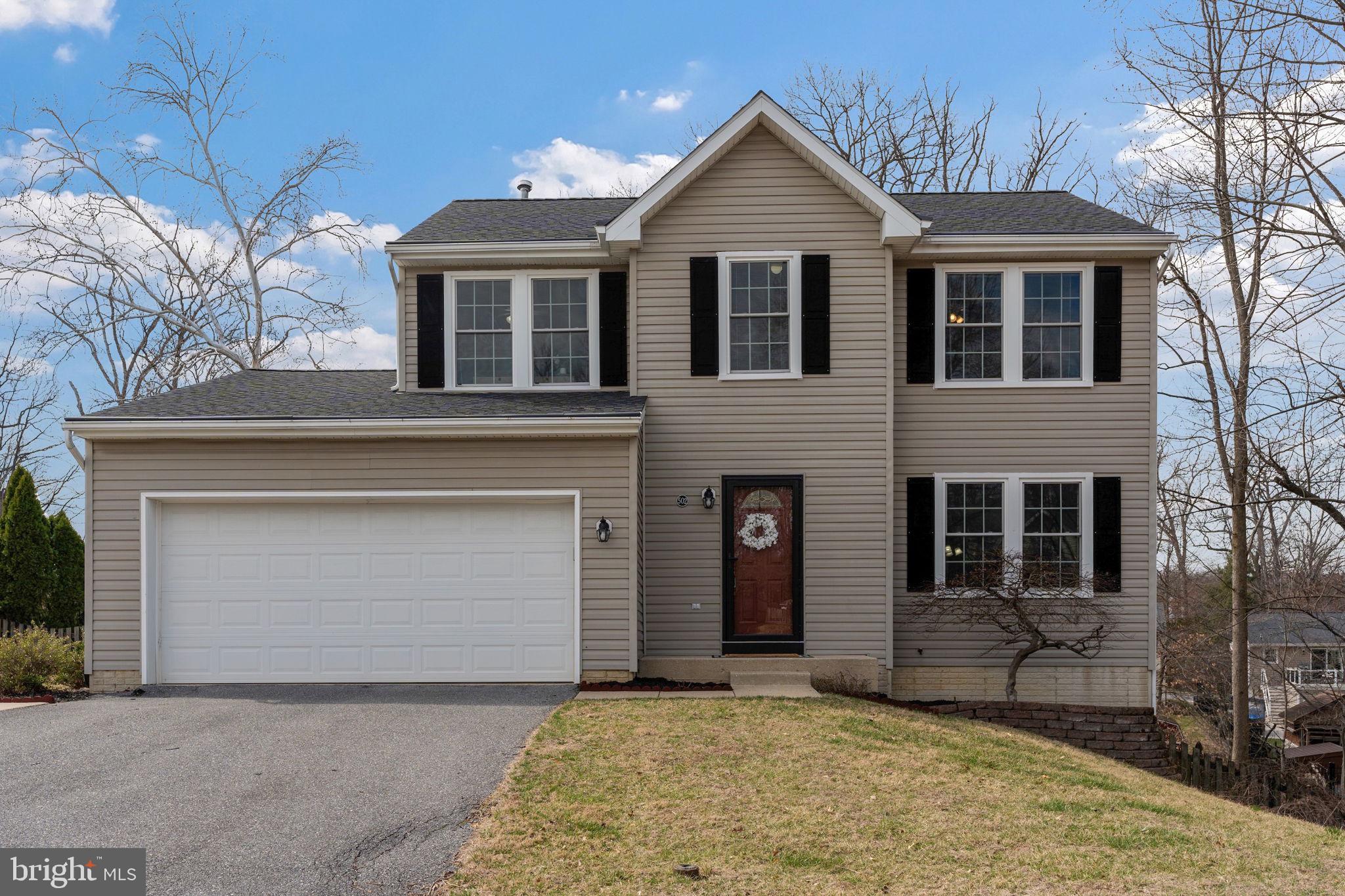 502 Durango Road Catonsville, MD 21228 - Photo 3 of 74 a front view of a house with a yard and garage