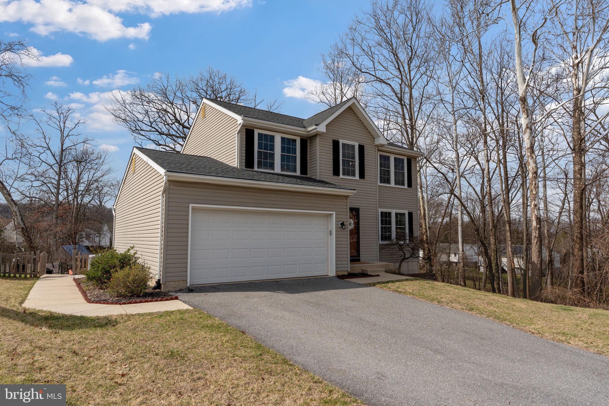 502 Durango Road Catonsville, MD 21228 - Photo 4 of 74 a front view of a house with a yard and garage
