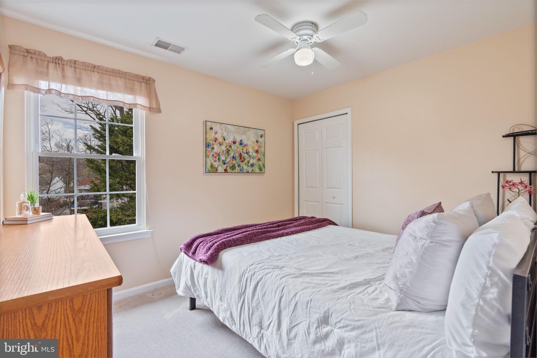 502 Durango Road Catonsville, MD 21228 - Photo 47 of 74 a bedroom with a large bed and a large window