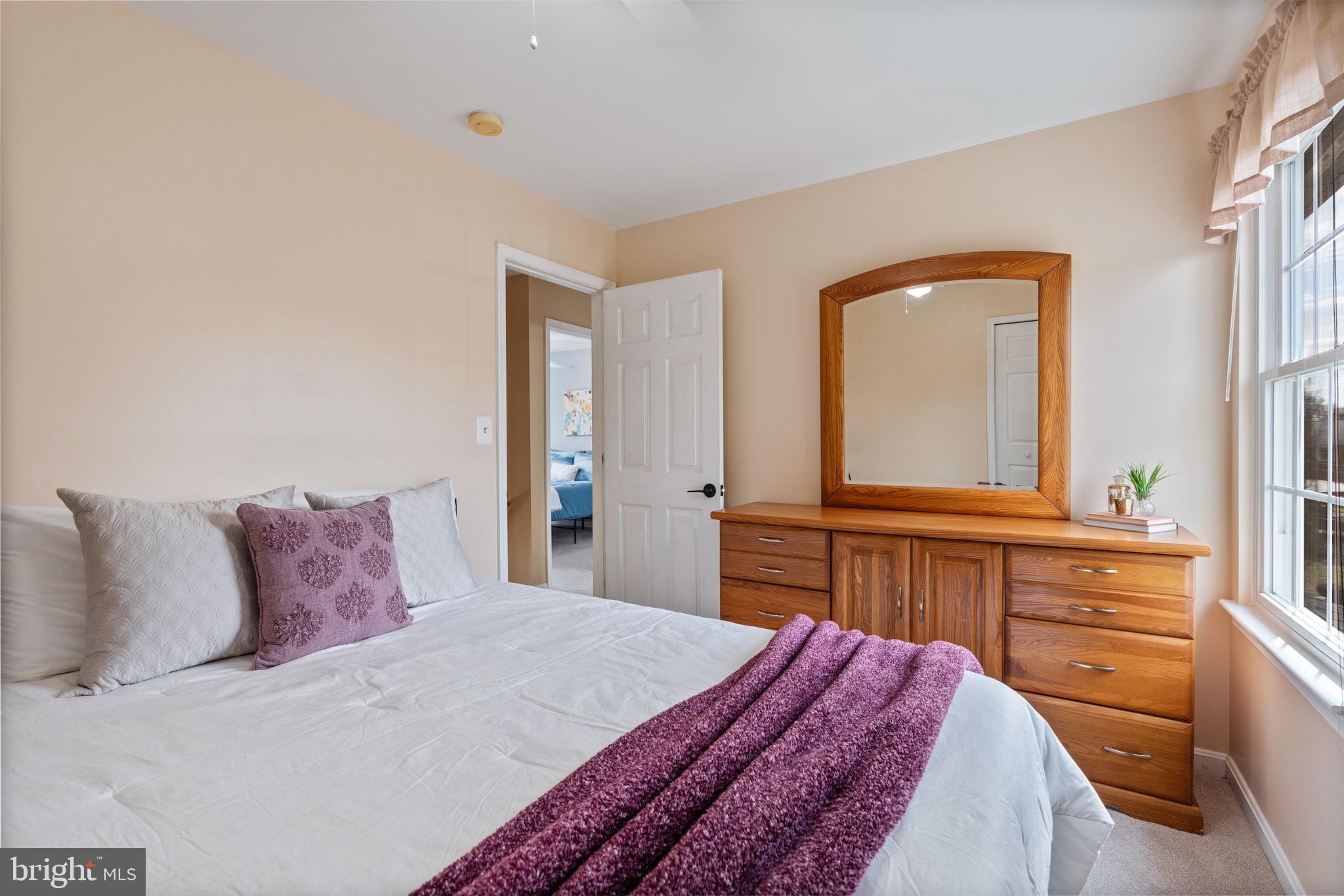 502 Durango Road Catonsville, MD 21228 - Photo 48 of 74 a bedroom with a bed and a mirror