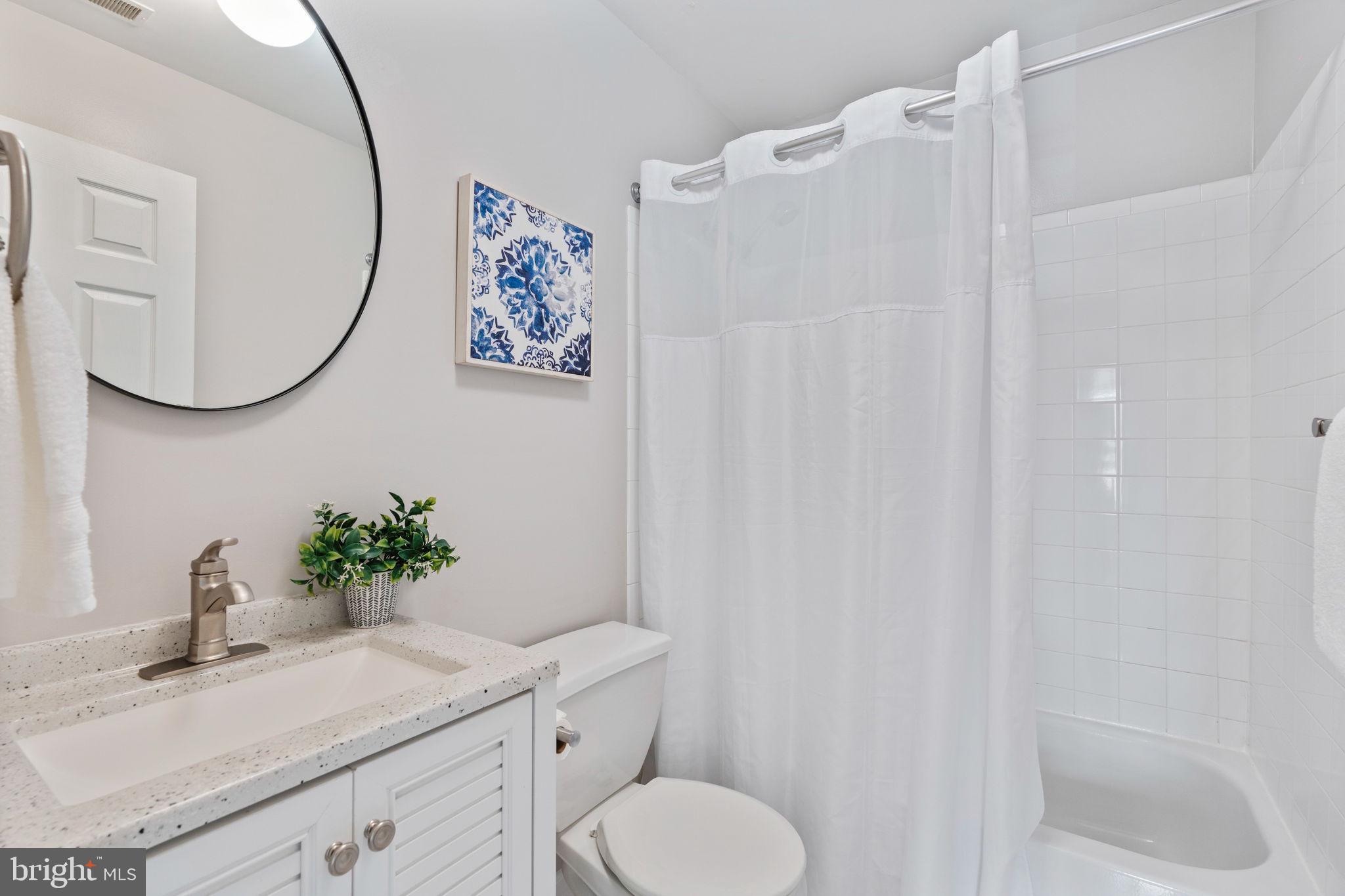502 Durango Road Catonsville, MD 21228 - Photo 49 of 74 a bathroom with a sink vanity mirror and toilet