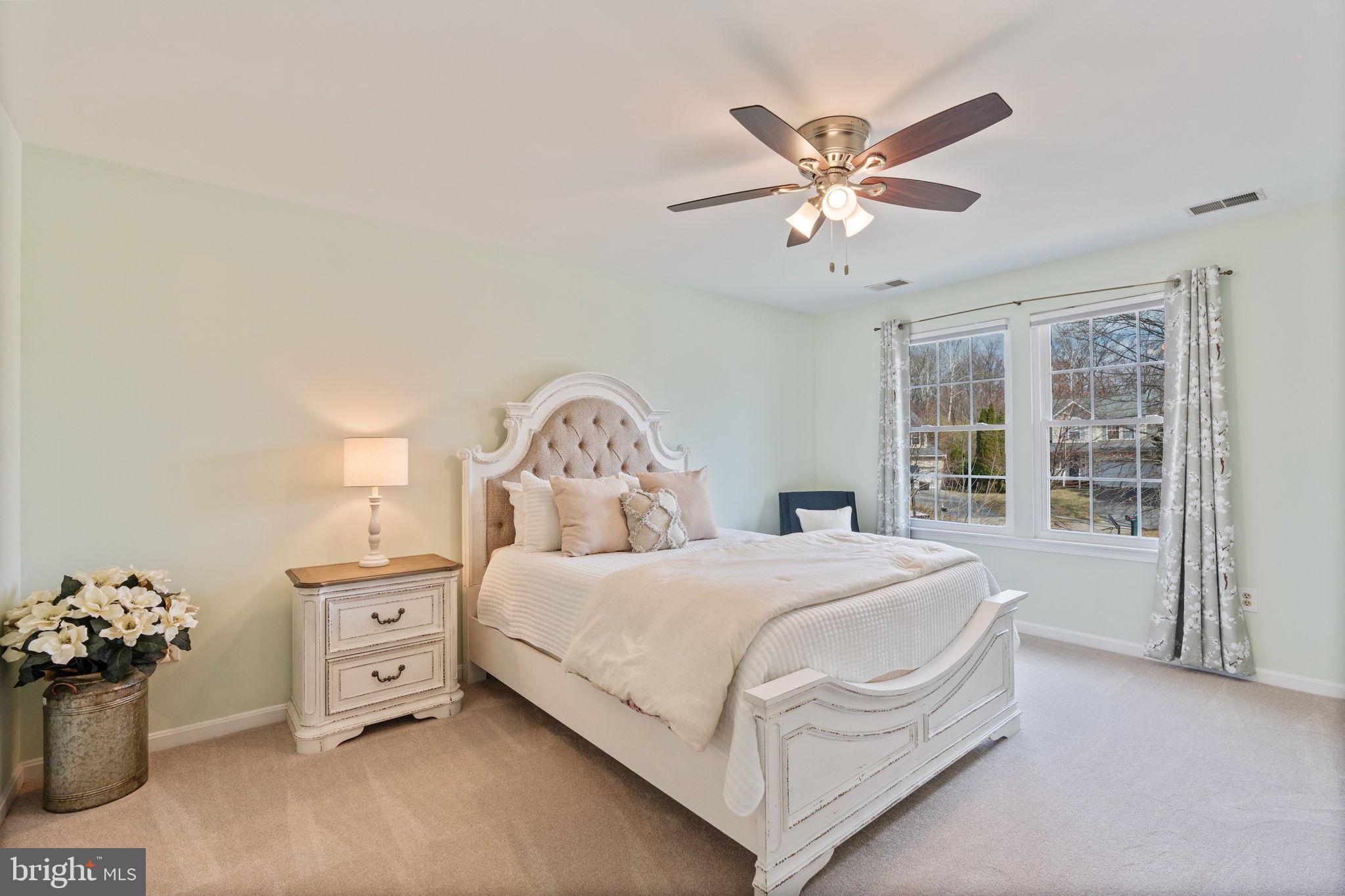 502 Durango Road Catonsville, MD 21228 - Photo 50 of 74 a bedroom with a bed and a chandelier