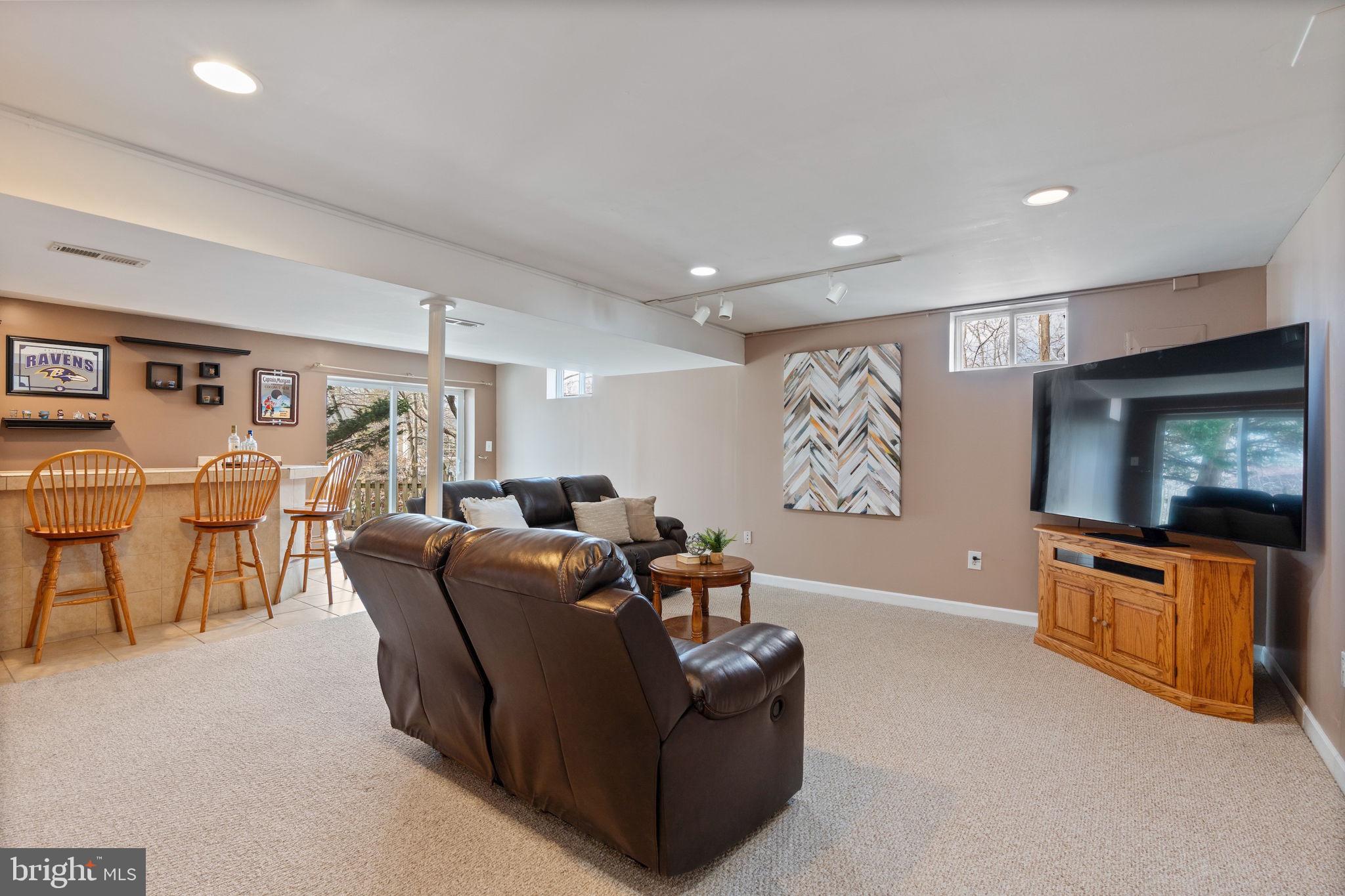 502 Durango Road Catonsville, MD 21228 - Photo 59 of 74 a living room with furniture and a flat screen tv