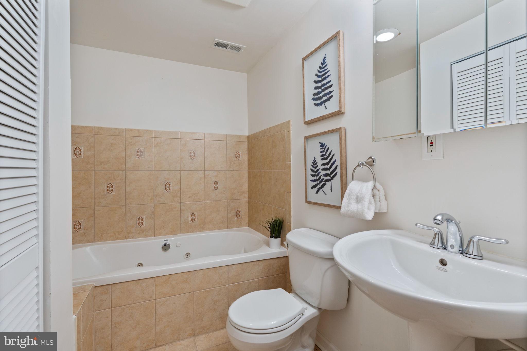502 Durango Road Catonsville, MD 21228 - Photo 64 of 74 a bathroom with a sink a toilet and a bathtub