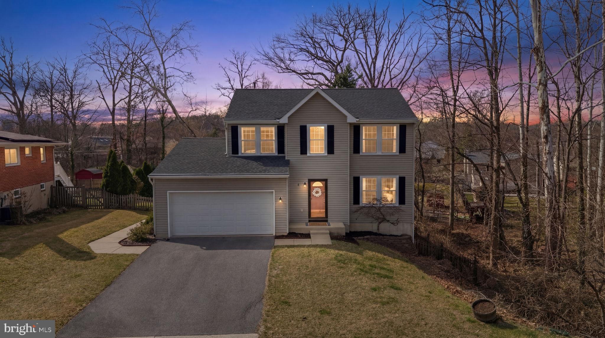 502 Durango Road Catonsville, MD 21228 - Photo 68 of 74 a front view of a house with a yard and garage