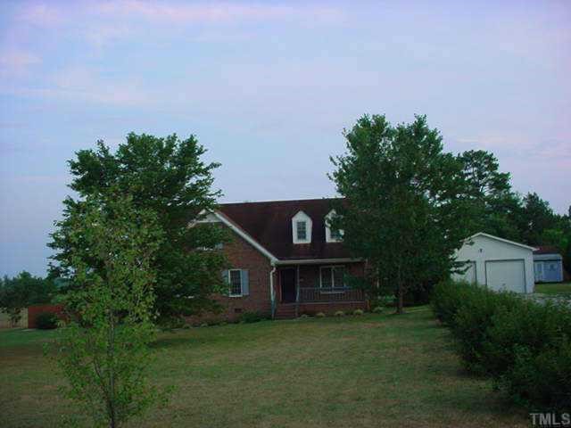 363 Gay Road Zebulon, NC 27597 - Photo 1 of 1 a house view with a sitting space and garden