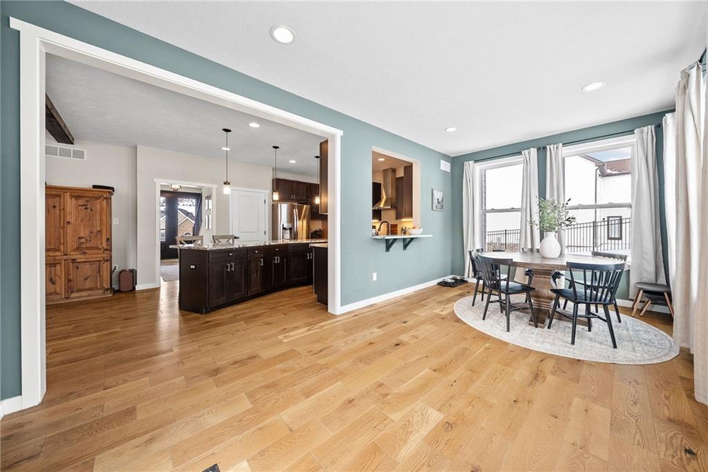 141 Morningstar Drive Rostraver Township, PA 15012 - Photo 15 of 39 A large sunroom filled with natural light, offering flexible space for dining, relaxing, or gathering throughout the day.