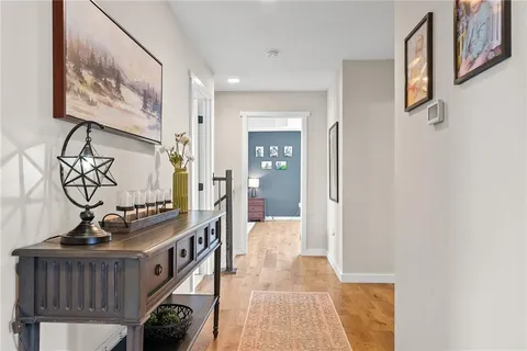 a view of an entryway with wooden floor
