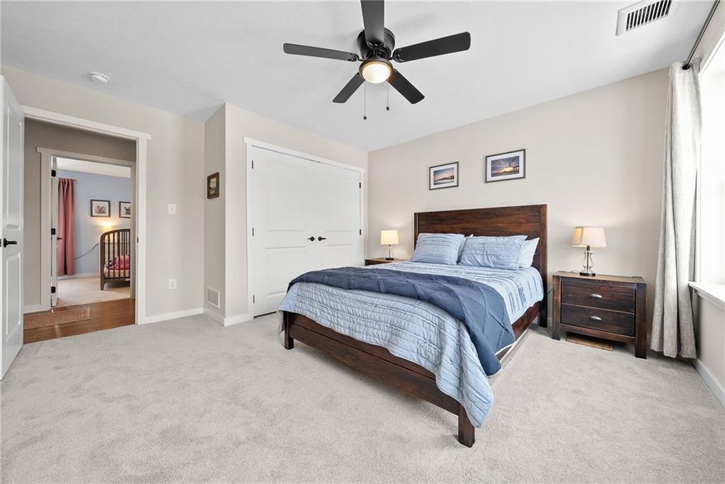 141 Morningstar Drive Rostraver Township, PA 15012 - Photo 26 of 39 A bright secondary bedroom with natural light and a comfortable, versatile layout.