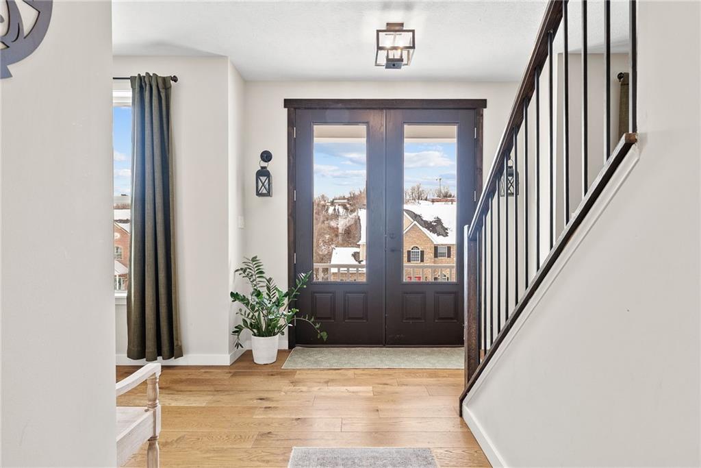 141 Morningstar Drive Rostraver Township, PA 15012 - Photo 3 of 39 A light-filled foyer with warm wood tones and thoughtful architectural detail that sets the tone from the moment you enter.
