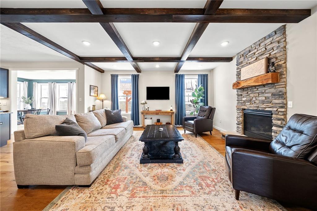 141 Morningstar Drive Rostraver Township, PA 15012 - Photo 6 of 39 Architectural coffered ceilings add depth and character, elevating the family room with subtle, timeless detail.