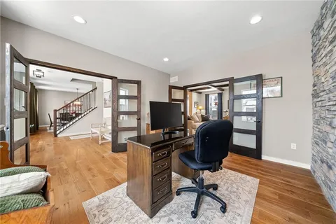 a view of a livingroom with workspace and a couch