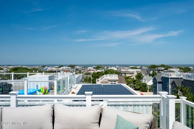 a view of roof with city view