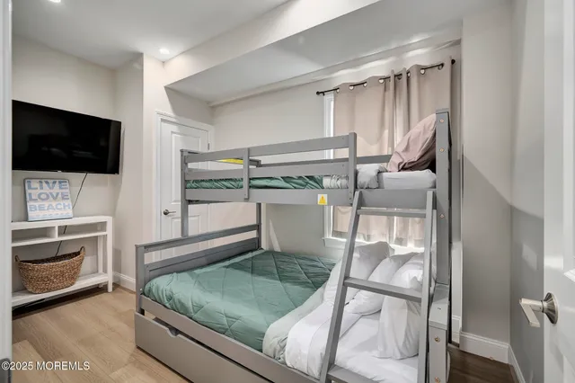 a living room with a flat screen tv and a fireplace