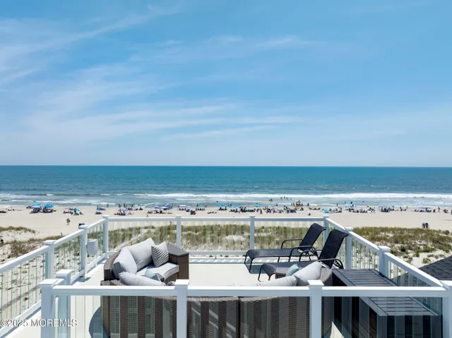 a view of a balcony with an ocean