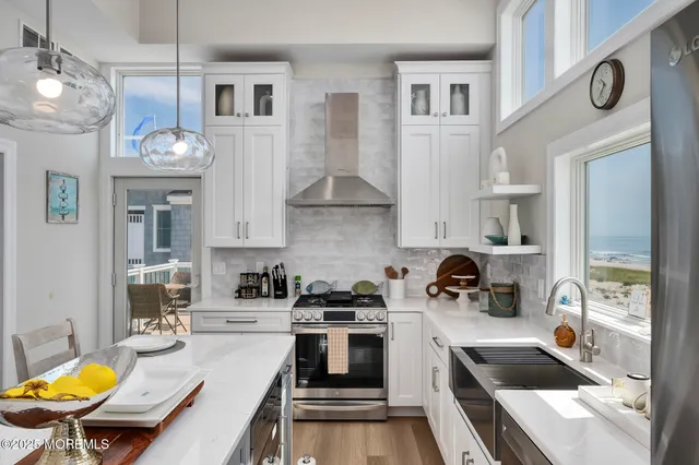 a kitchen with cabinets a sink and appliances