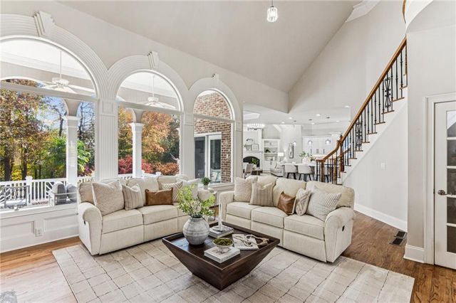 a living room with furniture or couches and a large window