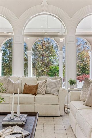 a view of a dining room with furniture wooden floor and chandelier