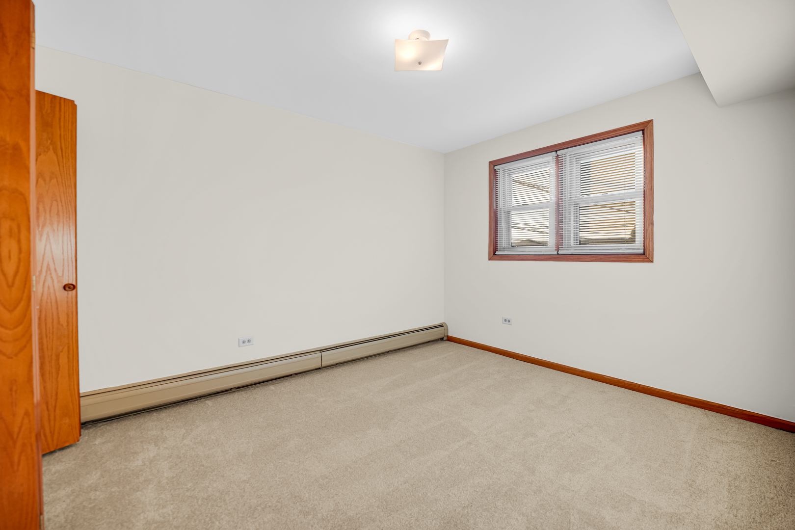 5324 Long Avenue, Unit 1 Chicago, IL 60638 - Photo 13 of 18 an empty room with a window
