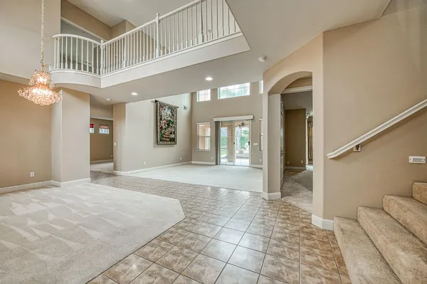 an empty room that has a mirror in it