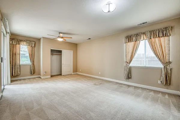 a view of a hallway with stairs