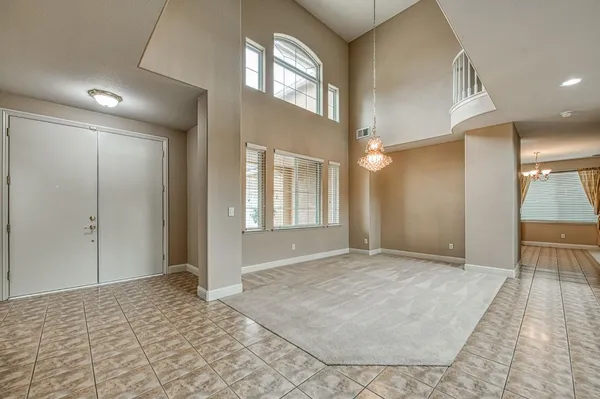 a room with a sink and cabinets