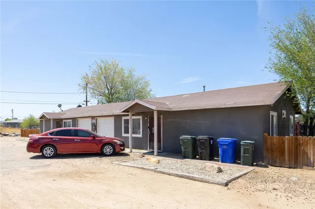 a view of a car parked in front of house