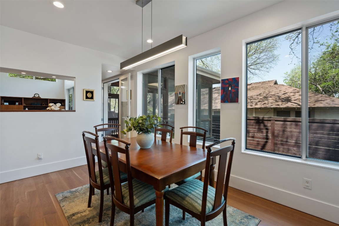 1809 Eva Street Austin, TX 78704 - Photo 17 of 27 a view of a dining room with furniture window and wooden floor