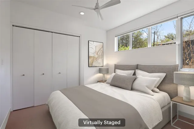 a bedroom with a bed chair and couch