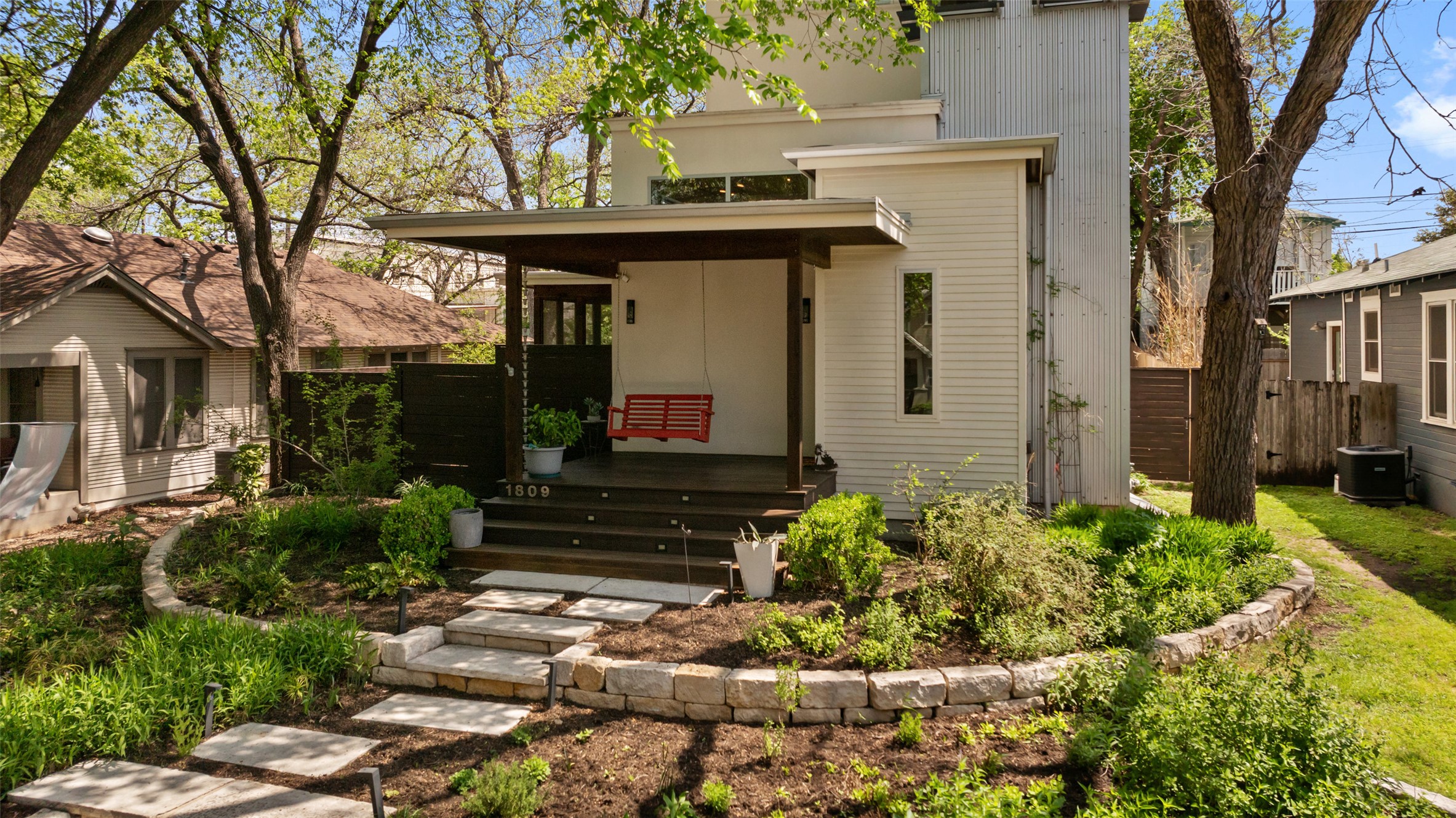 1809 Eva Street Austin, TX 78704 - Photo 2 of 31 a front view of a house with a yard