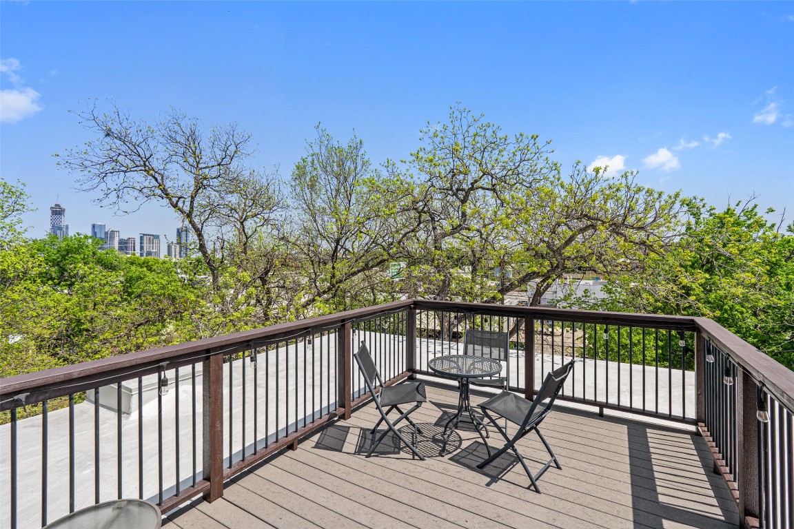 1809 Eva Street Austin, TX 78704 - Photo 26 of 27 a view of a balcony with wooden floor and fence