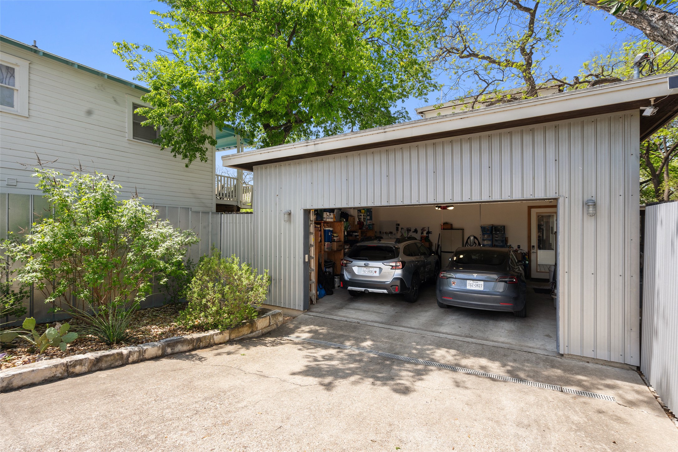 1809 Eva Street Austin, TX 78704 - Photo 30 of 31 An oversized two-car garage and two-car driveway provides ample storage and secure parking. Or add a carport and convert the garage into a guest house, or income-producing townhouse.