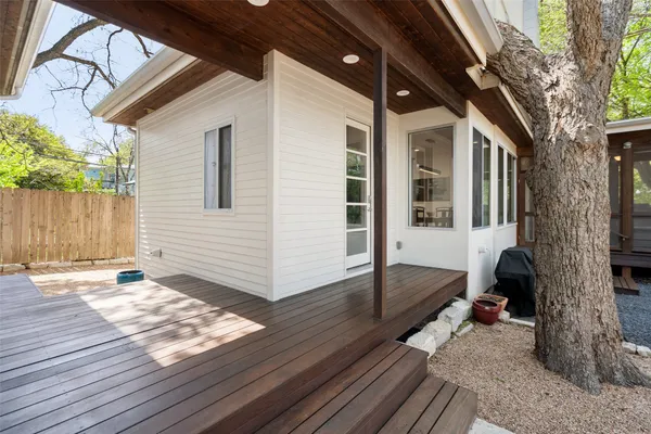 a view of a porch with wooden floor