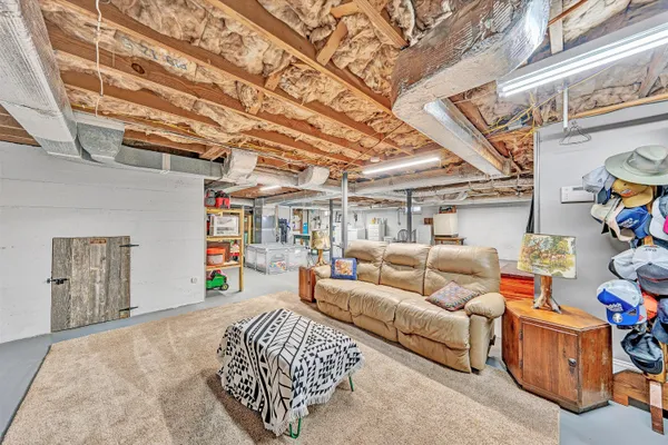 a view of a livingroom with furniture and a flat screen tv