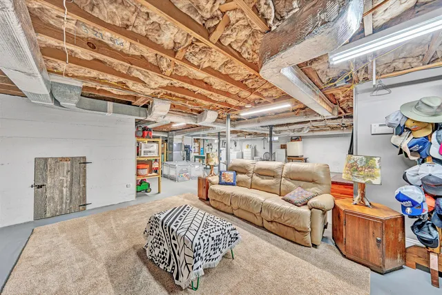 a view of a livingroom with furniture and a flat screen tv