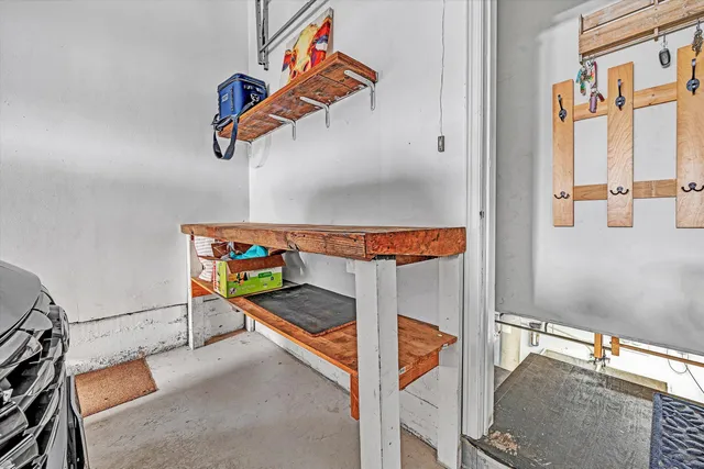 a view of a house with a big yard and large trees