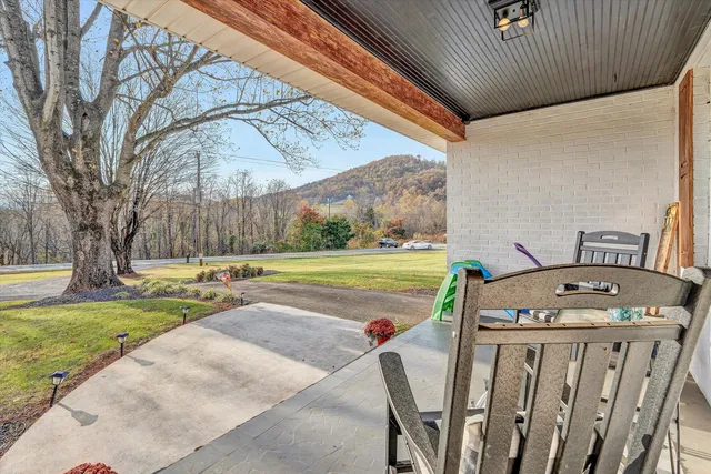 a view of a swimming pool with a patio